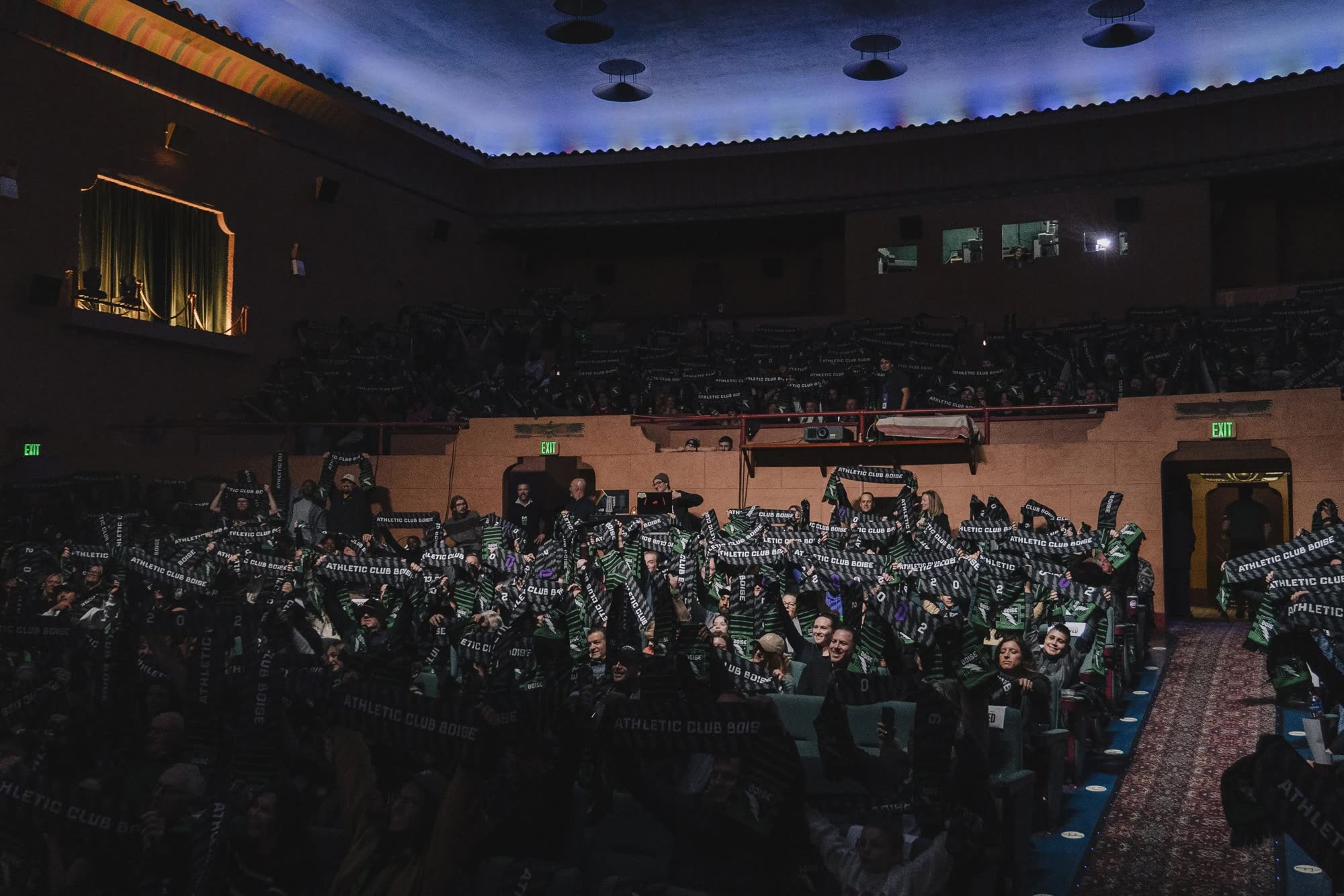 The Egyptian Theatre crowd with Athletic Club Boise scarves raised at the kit reveal