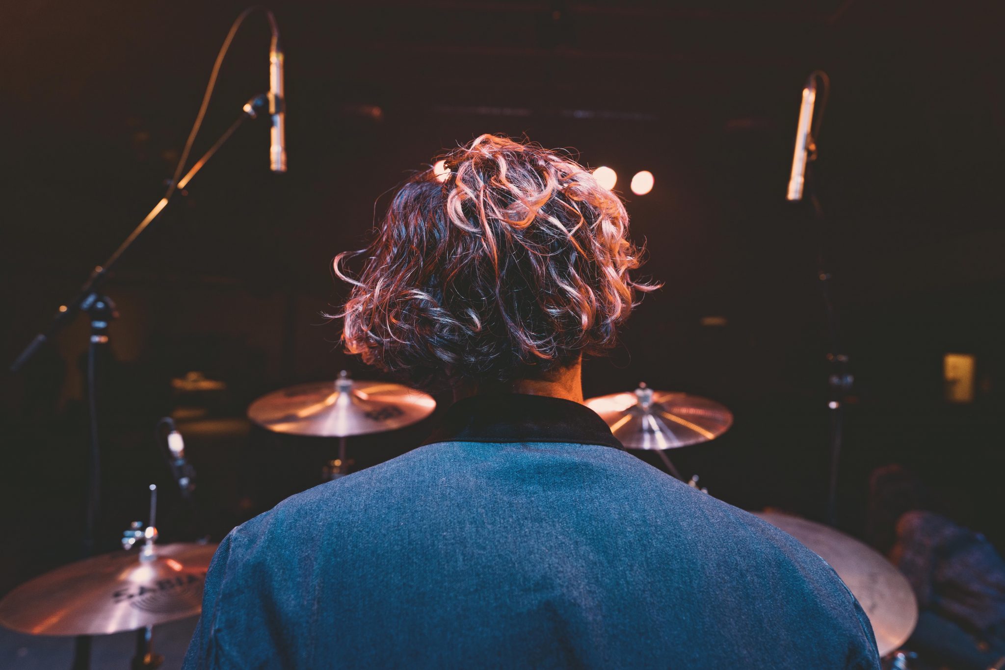 Studio: the drummer behind the kit, mics up
