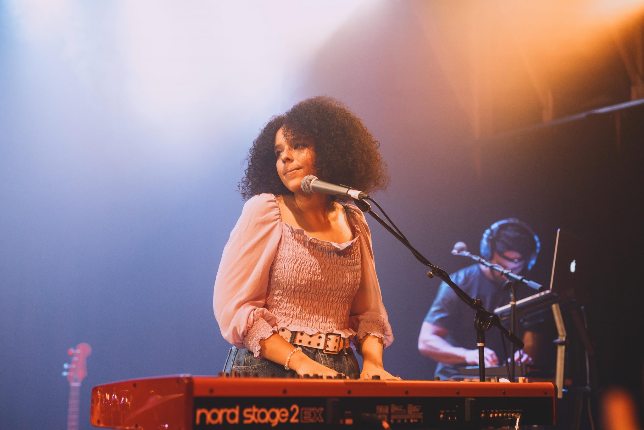 Stage: the singer at her keyboard under the lights