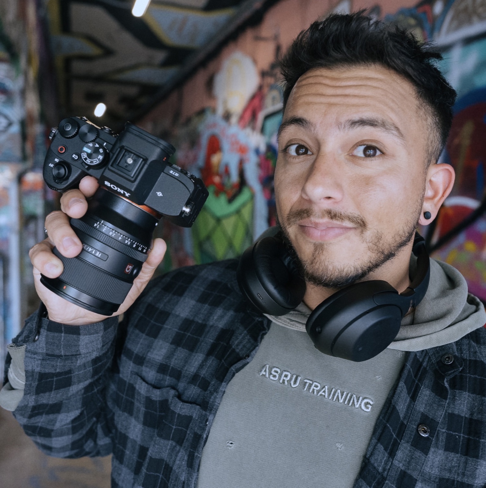 DJ presenting camera gear to the lens