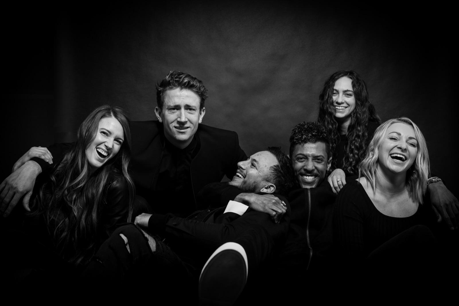 The crew laughing in the studio