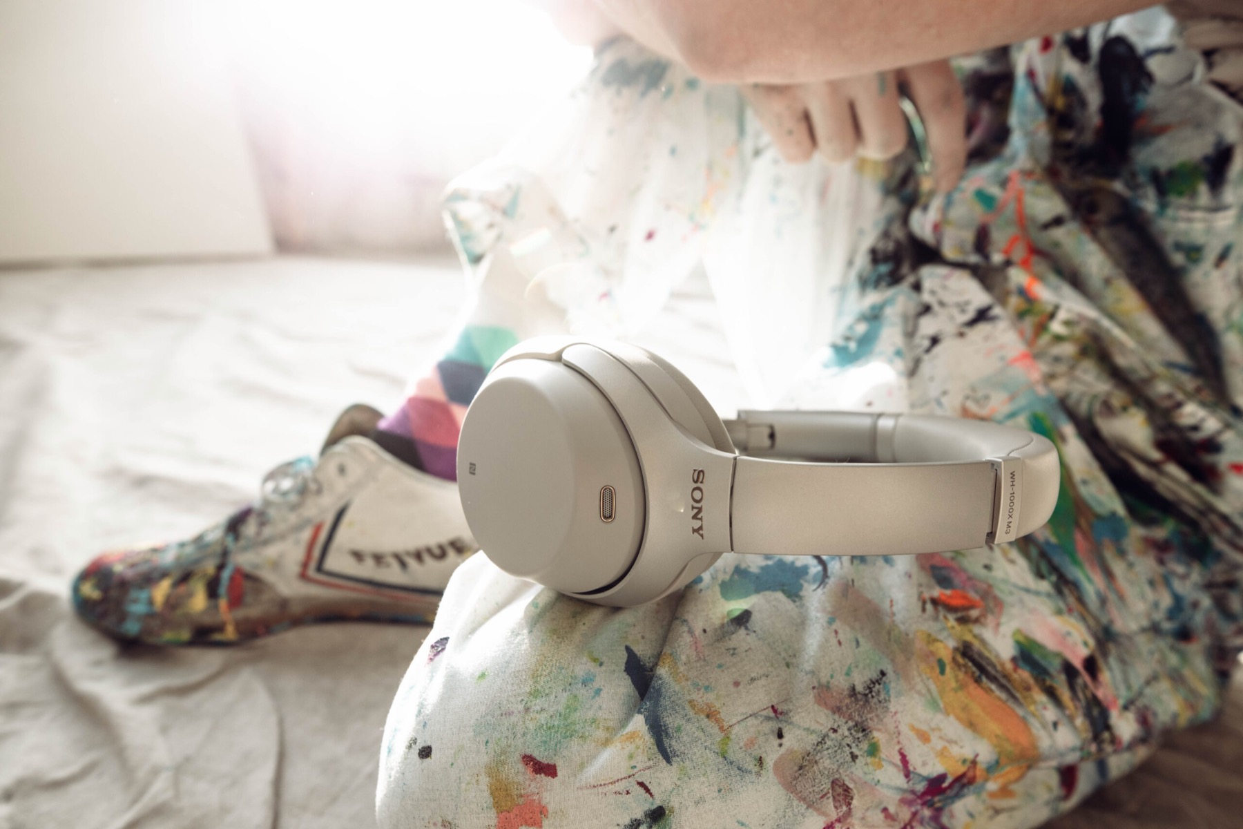 Sony WH-1000XM3 on paint-splattered pants, Flow State campaign, on @sonyelectronics