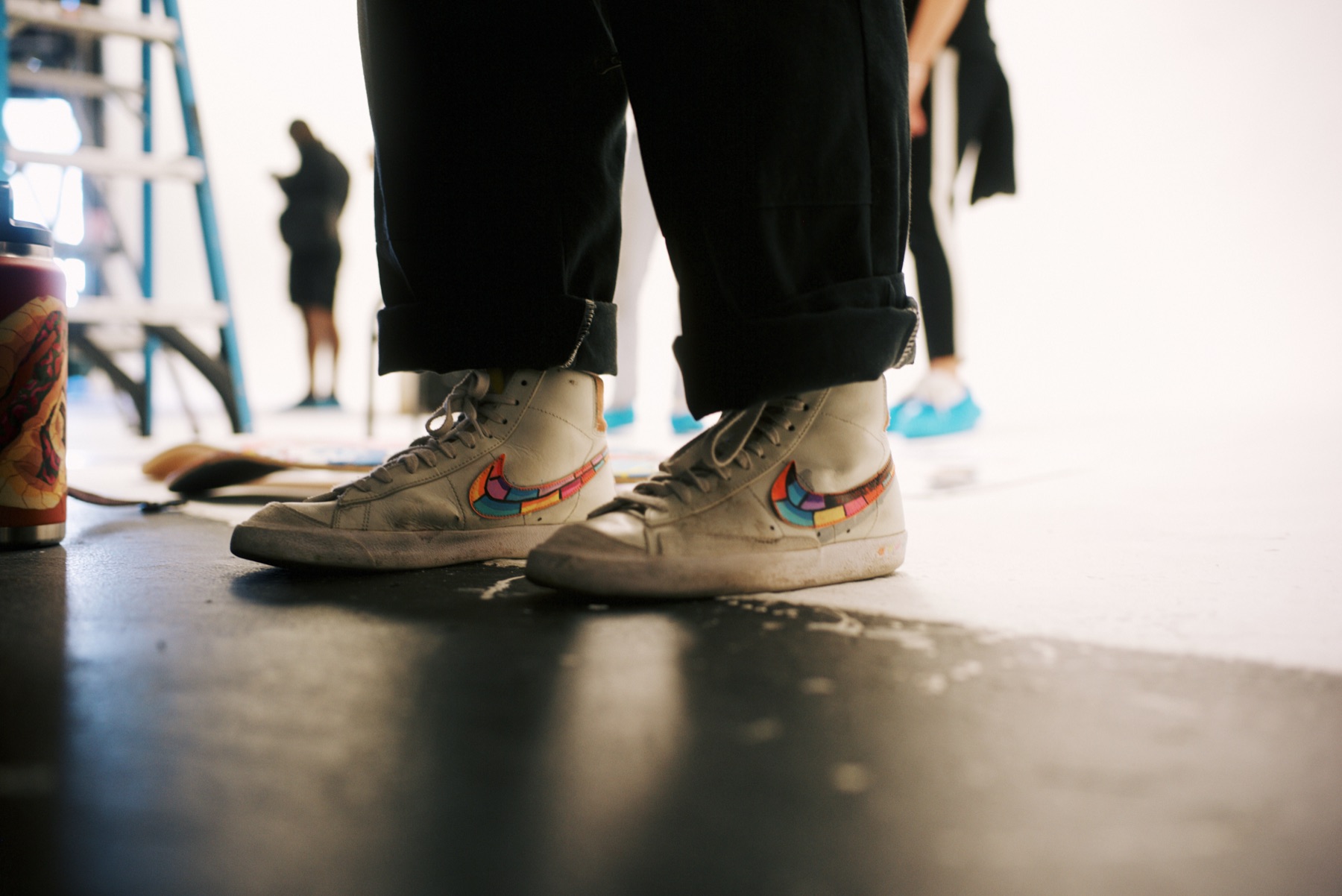 Paint-flecked shoes on set