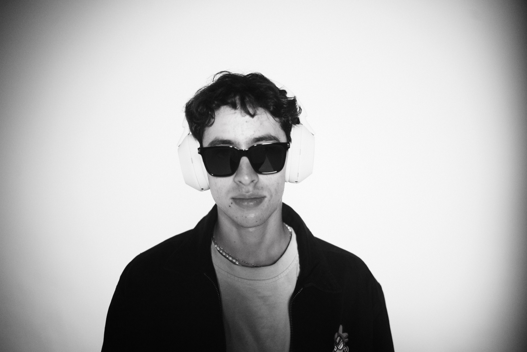 Portrait of a creator wearing the XM5, black and white
