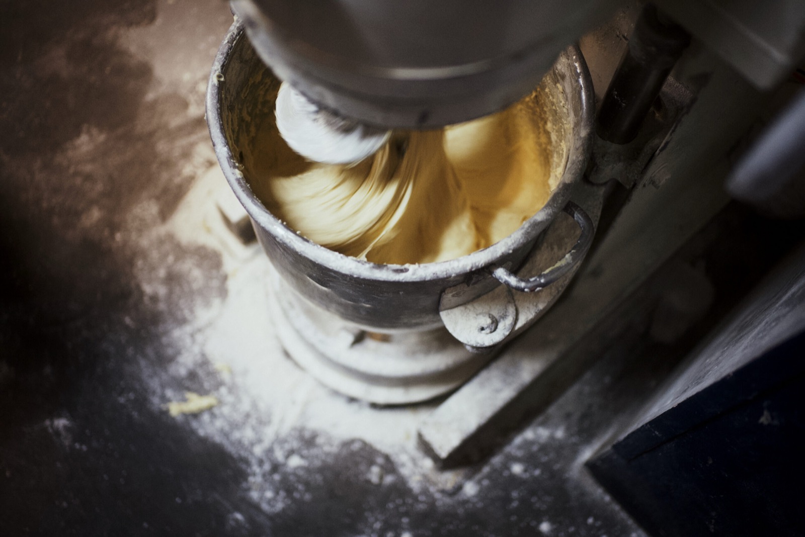 Film poster: waffle batter turning in the mixer, flour on the floor