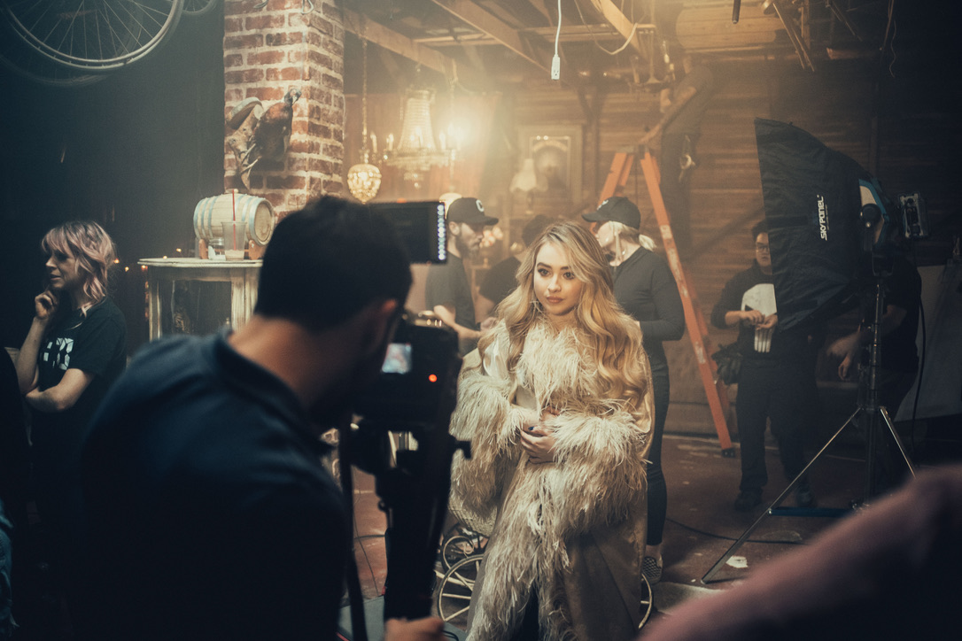 On set: a shoot in a warm, moody studio