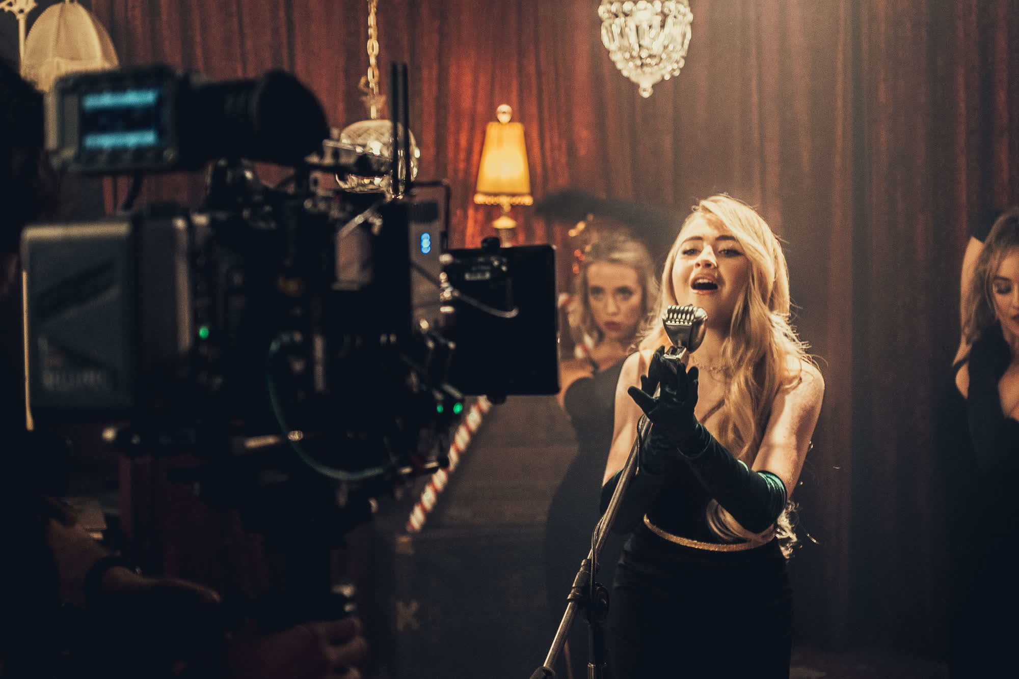 On set: a singer performing for camera